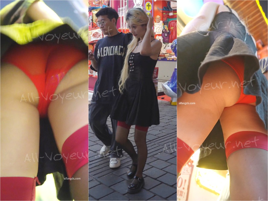 セクシーなサスペンダースカート、黒のストッキング、ニーソックスの姉妹。半透明の赤い内側の前面が黒に見える