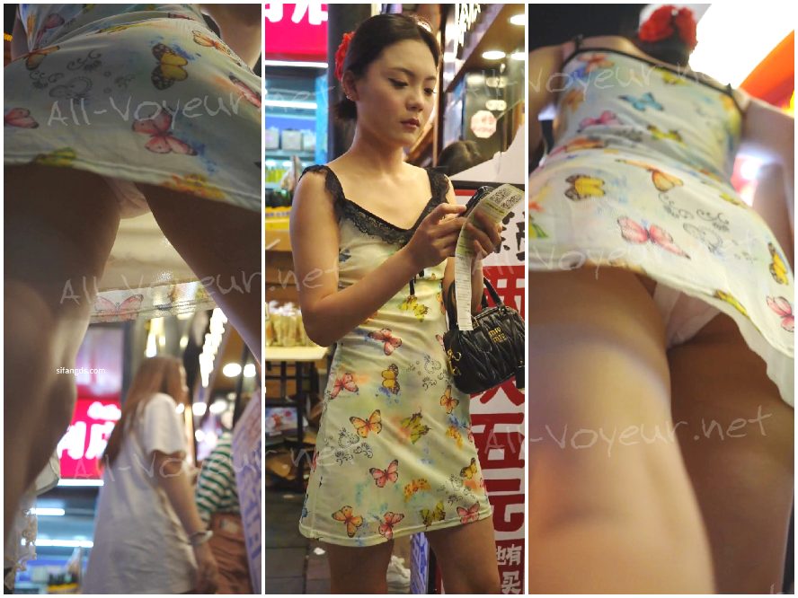 レースのホルターネックの花柄ドレスを着た女の子。ミルクティーを買っているときにベースレイヤーを引き裂かれました。中には羽根まで入っていました!