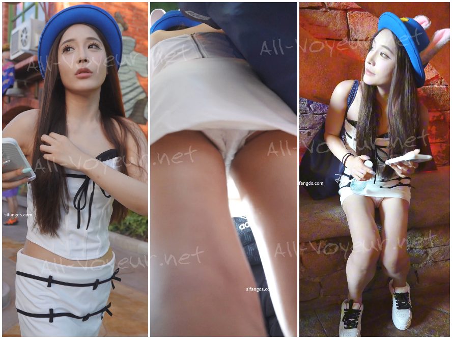 ピンクの長い髪と花柄のワンピースを着た女の子。彼女の柄物の紙の下着が洋服店で売り切れていました。