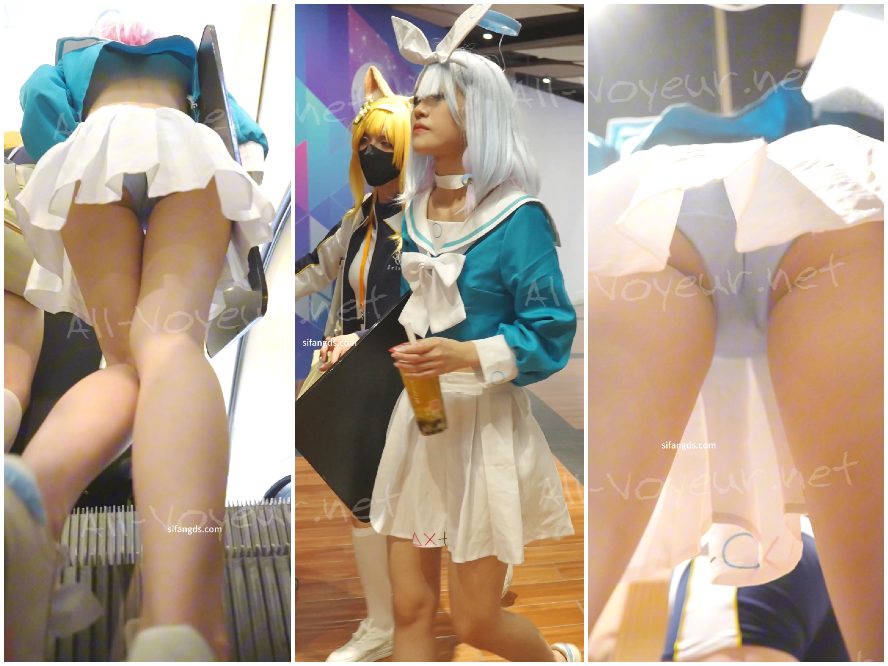 赤いホルターネックのドレスを着たブロンドの女性。彼女のキュートな漫画をテーマにしたレースのランジェリーは、ずっと写真に撮られていました。