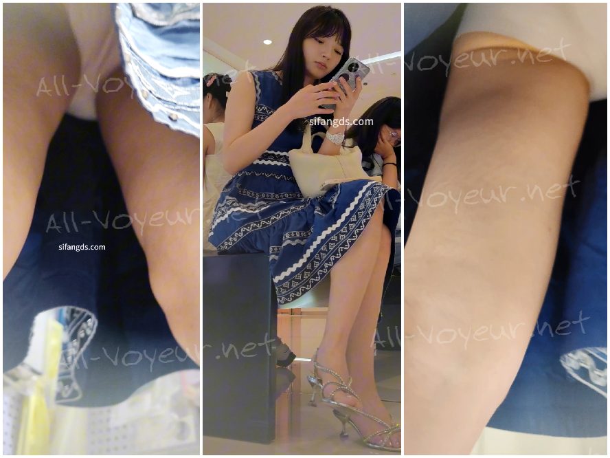 驚くほど美しい女性が青いドレスを着て、黄色い下着を身につけて一人で買い物に来ます。