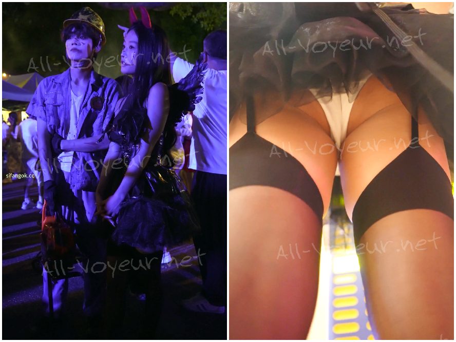 透け感のあるハイヒールのレースの天使のドレスを着た美しい女性。花柄のレースに内蔵されたライトが彼女のお尻を照らしています。