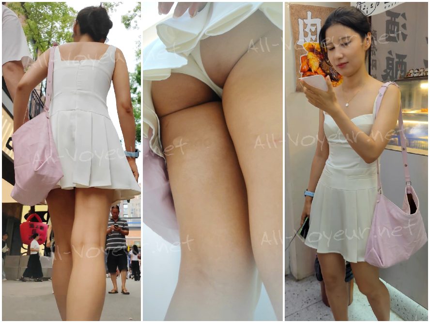 白いドレスを着た若い女性がボーイフレンドと一緒に買い物に来ています。彼女は白い下着を身につけています。白いドレスを着た若い女性がボーイフレンドと一緒に買い物に来ています。彼女は白い下着を身につけています。