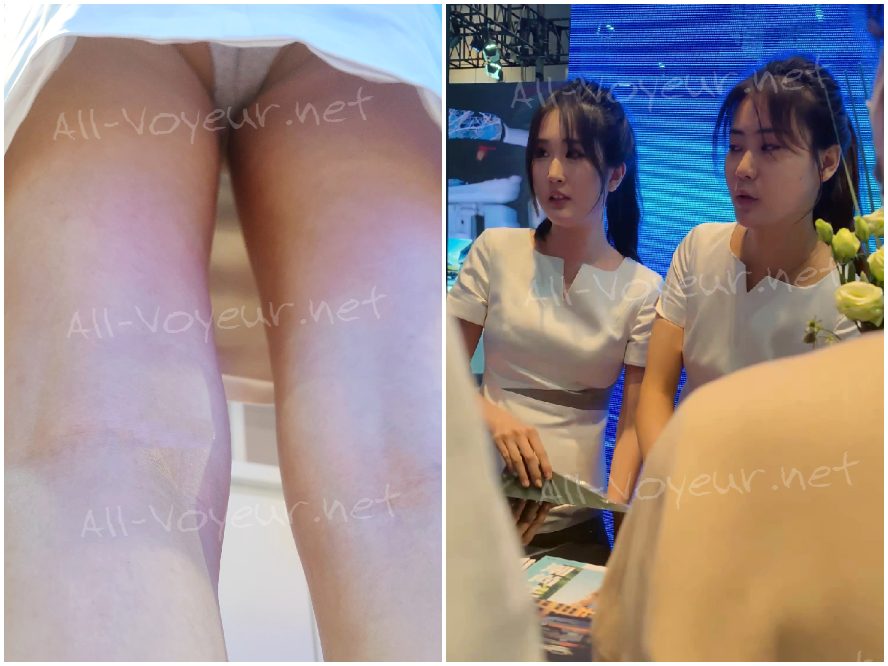 カーショーの司会者は、運転席に座ったときも顧客へのサービスに集中していました。グレーの内装は...