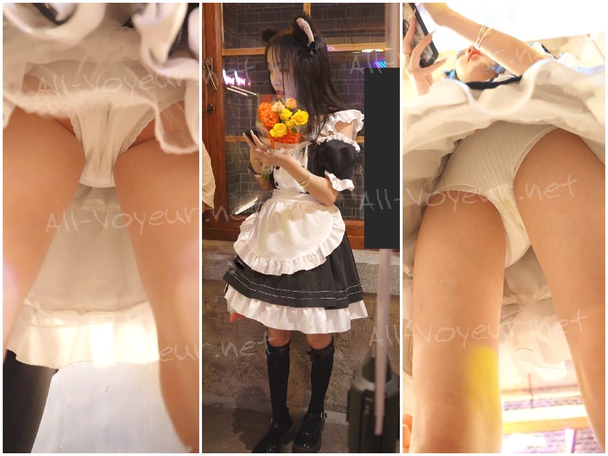 スパゲッティストラップのレースドレスを着た若い女性が買い物をしている…彼女の縫い目のない下着は臀部に食い込んでおり、陰毛が見えている。