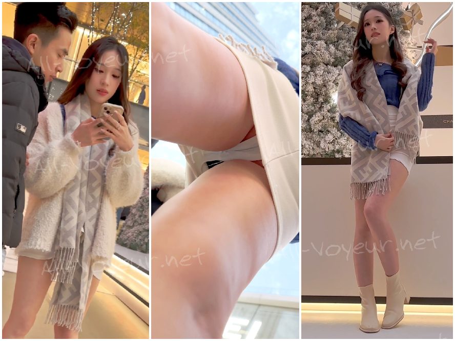 抜群のスタイルを持つ美しい女性が、冬に素足で写真撮影に臨んだ。短いスカートの下から、黒い下着がちらりと見えていた。